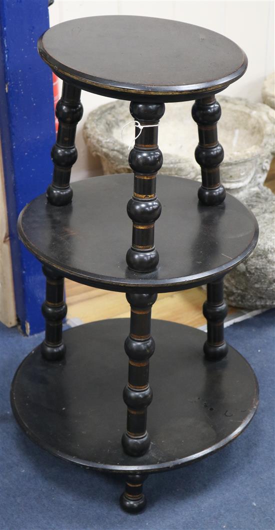 An ebonised three tier stand W.44cm